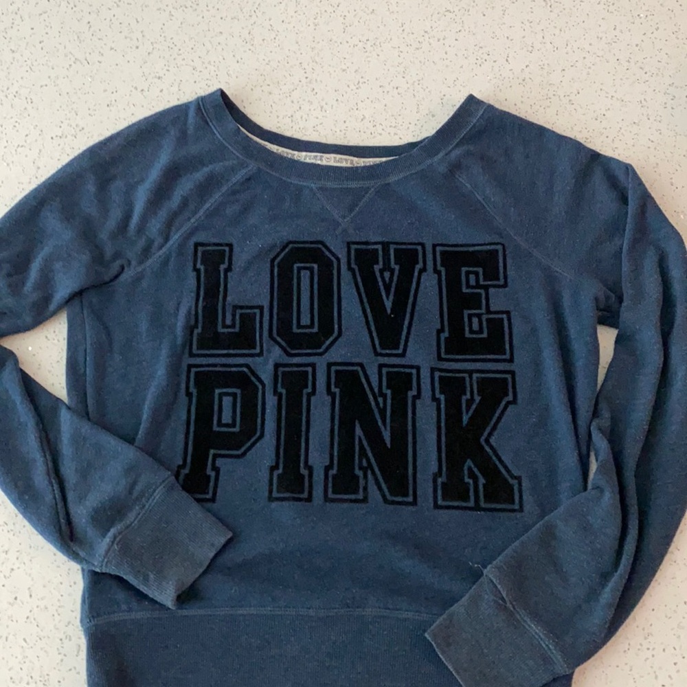 Pink sweatshirt.